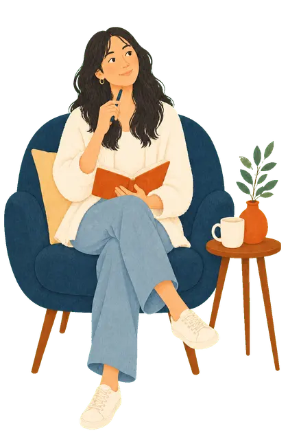 An adult reflecting with a notebook in a comfortable chair